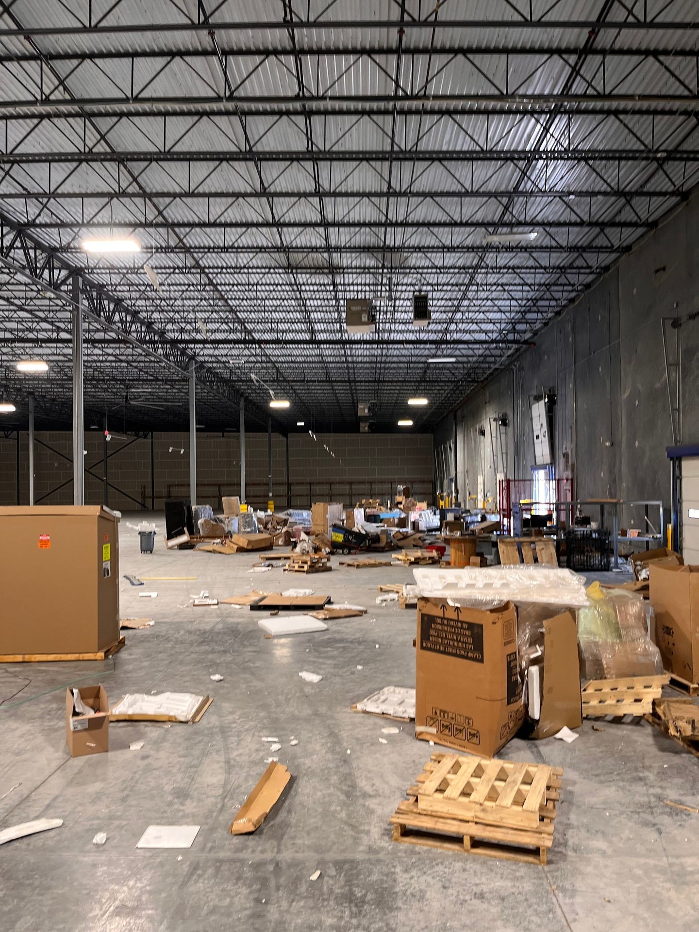 warehouse full of junk like furniture and packing boxes